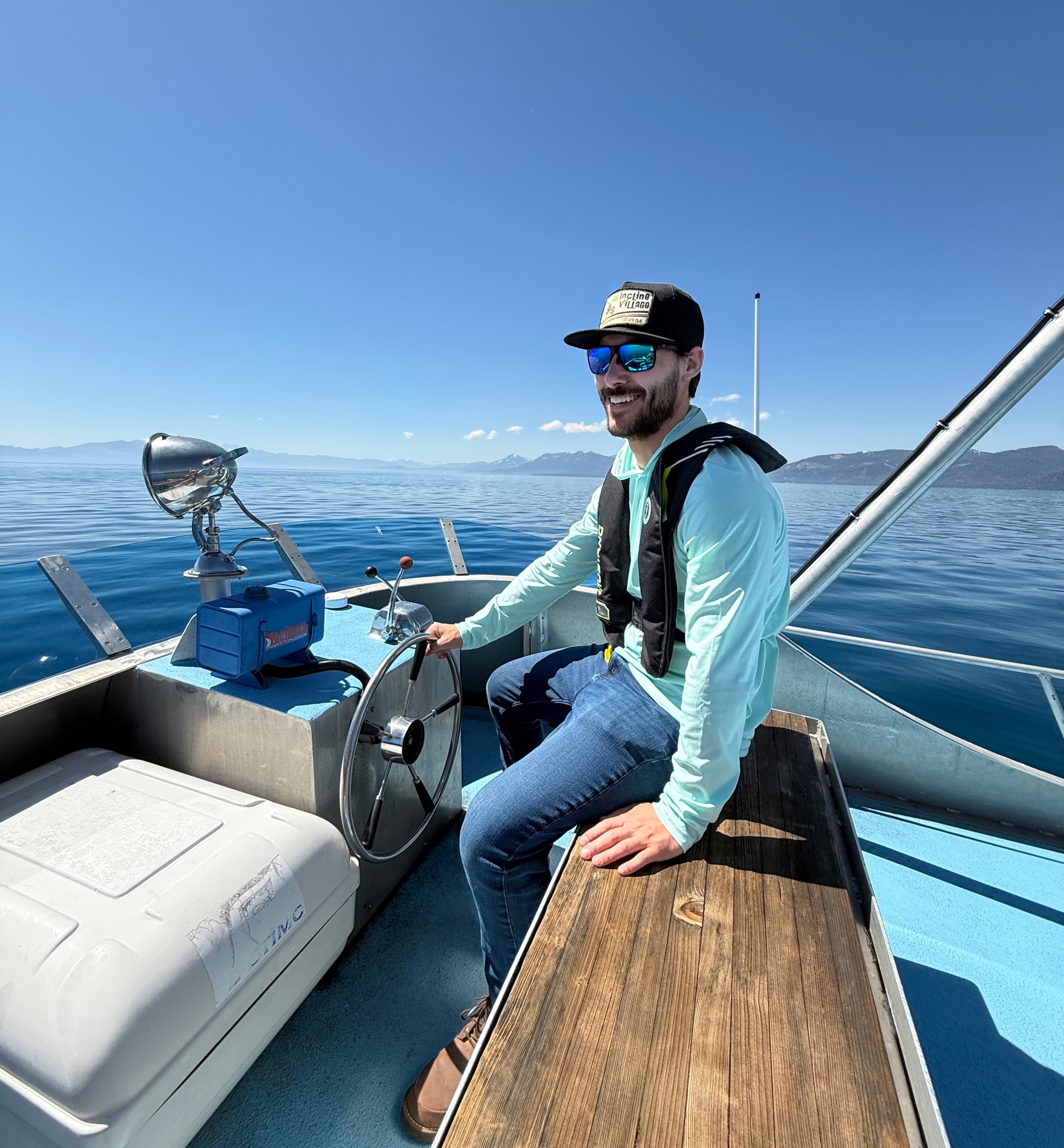 A photo of Nico at the helm of the UC Davis Research Vessel John LeConte.